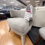 This comfy, chic grey horseshoe accent chair is the perfectly functional stylish touch to any room!