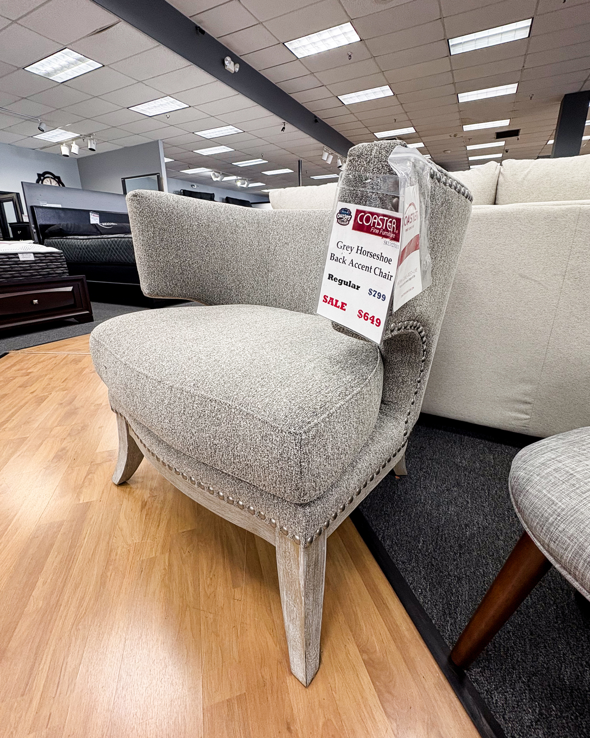 This comfy, chic grey horseshoe accent chair is the perfectly functional stylish touch to any room!