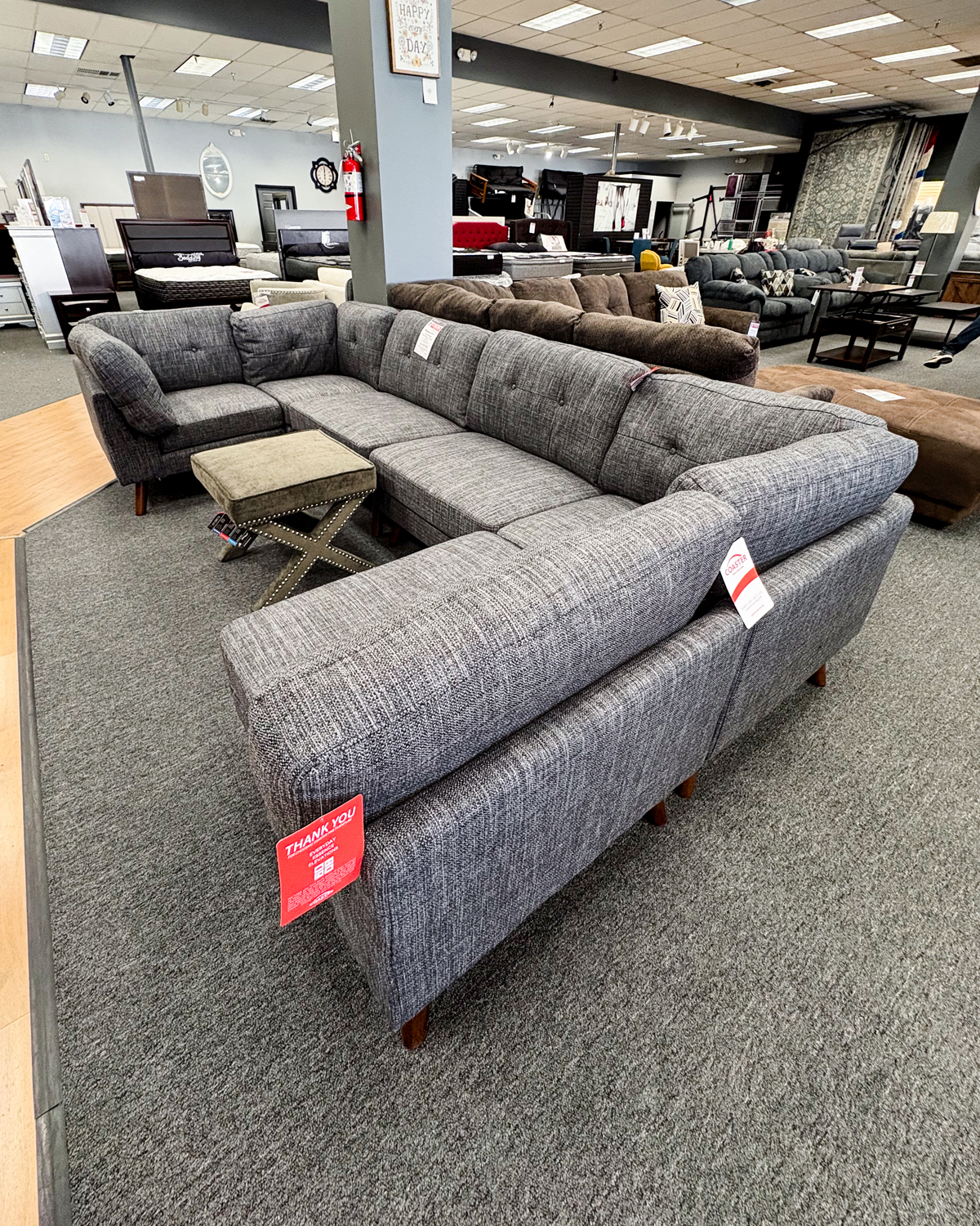 Upgrade your couch before the family crashes your house with this gorgeous grey lounger couch and greige footstool!